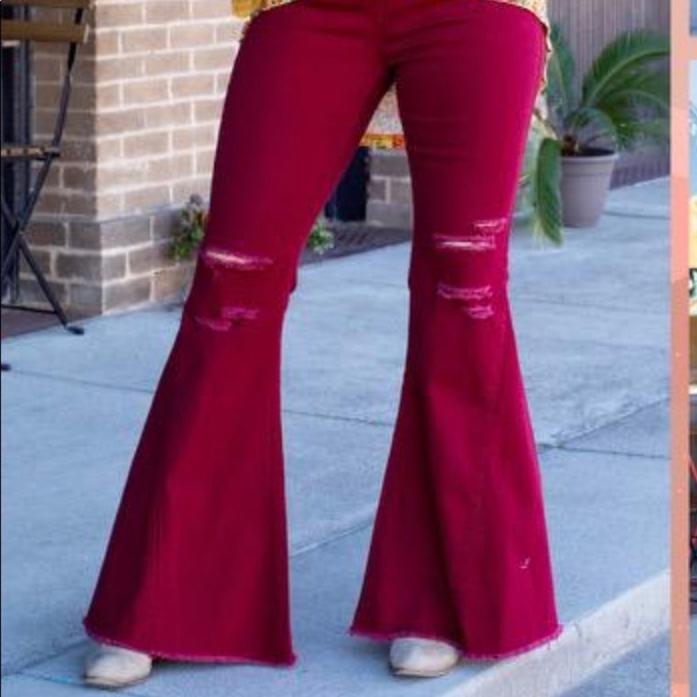 Deep red distressed high rise flare jeans